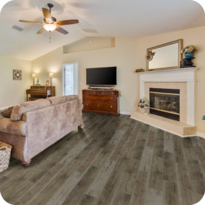 Currents Plus, LVP Flooring, Navajo shown in a living room with a fireplace